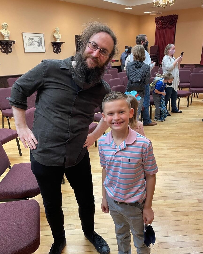 Devon with a student